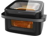 an image of a black air fryer with food inside of it