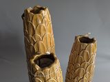 two vases that are sitting on a table