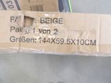 a cardboard box that has been wrapped up and is sitting on the floor