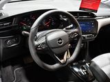 a steering wheel and dashboard of a car in a showroom