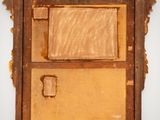 an old wooden picture frame with a picture of a person in it