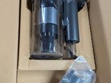 a box with a vacuum and other items inside of it