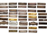 a lot of different types of hair clips on a white surface
