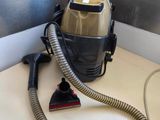 a vacuum that is sitting on a counter next to a cord