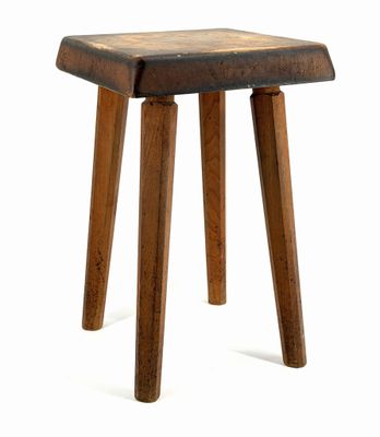 an image of a wooden stool with three legs on a white background