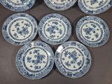six blue and white plates with floral designs on them on a table