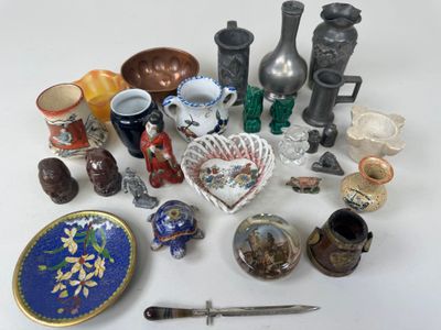 many different types of vases and other items on the table
