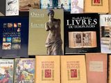 a lot of books that are on a table