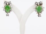 a pair of green jade and diamond earrings