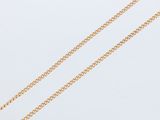 a gold chain necklace with a heart pendant on a white background