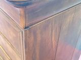 a small wooden box with a wooden top on a table