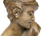 bronze statue of a child holding a dog on a white background