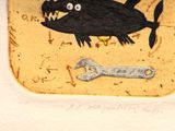 a picture of a plate with a picture of a fish and a wrench on it