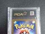 the pokemon card is in the plastic case on the table