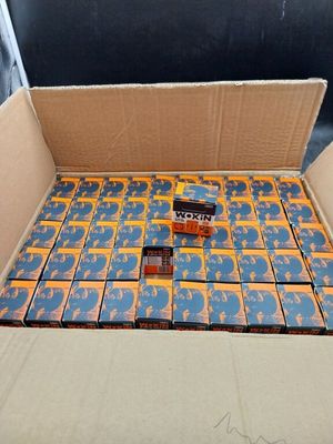 a cardboard box filled with lots of orange and blue candy