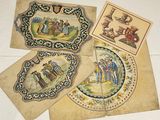 several old postcards with pictures of people on them on a table