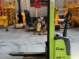 an image of a forklift is parked in a warehouse