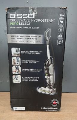 the box of the bissell pro select vacuum is open on the table