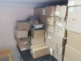 many boxes stacked on top of each other in a room
