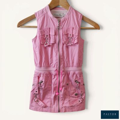 an image of a pink shirt dress hanging on a hanger