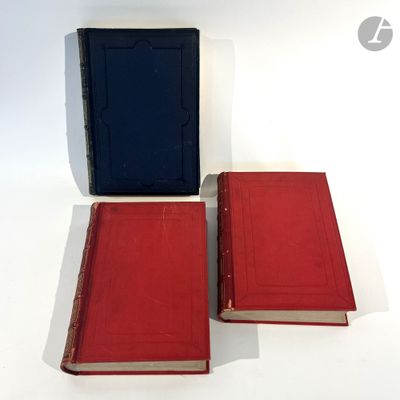 two red and blue books sitting next to each other on a white surface