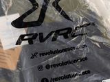 a plastic bag that has a black shirt on it