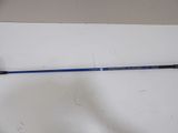 a close up of a golf club on a white surface