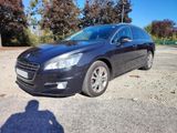 a picture of a black car parked in a parking lot