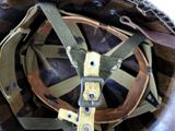 a close up of a helmet with a strap on it