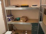 a small room with shelves and shelves with boxes on them