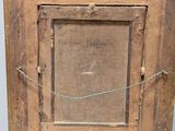 an old wooden picture frame with a picture of a man on it