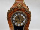 a small clock that is sitting on a table