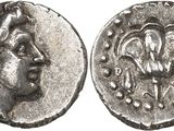 a silver coin with an image of a woman on it