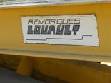 a sign on the back of a yellow truck