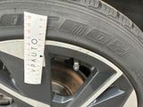 a close up of a tire with a measuring tape on it