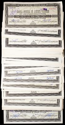 a stack of twenty dollar bills sitting on top of each other