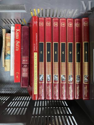 many books that are on a shelf in a book case