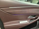 a close up of a car door handle with a sticker on it