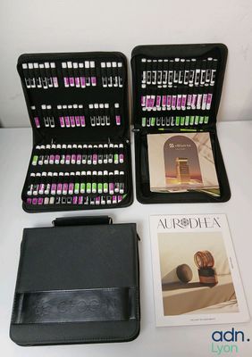 a black case that has a book, a book, and a pen on it
