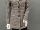 a mannequin wearing a black and white checkered jacket and leggings