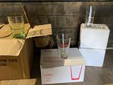 three boxes and two glasses on the floor