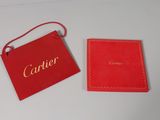 cartier red box with gold logo and red card holder