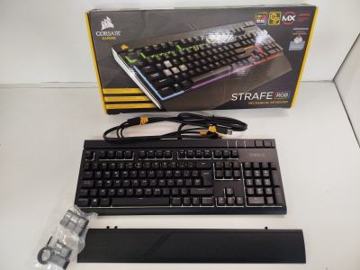 a keyboard and a mouse sitting on a table next to a box
