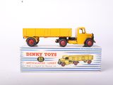 a toy truck that is sitting on top of a box