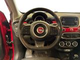the interior of a small car with a steering wheel and dashboard