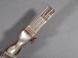 a silver fork that is sitting on a table