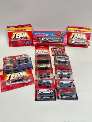 a lot of toy cars that are sitting on a table