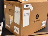 a cardboard box sitting on top of a metal table