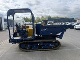 a picture of a small blue machine parked in a parking lot