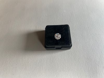 an image of a diamond ring on a white surface